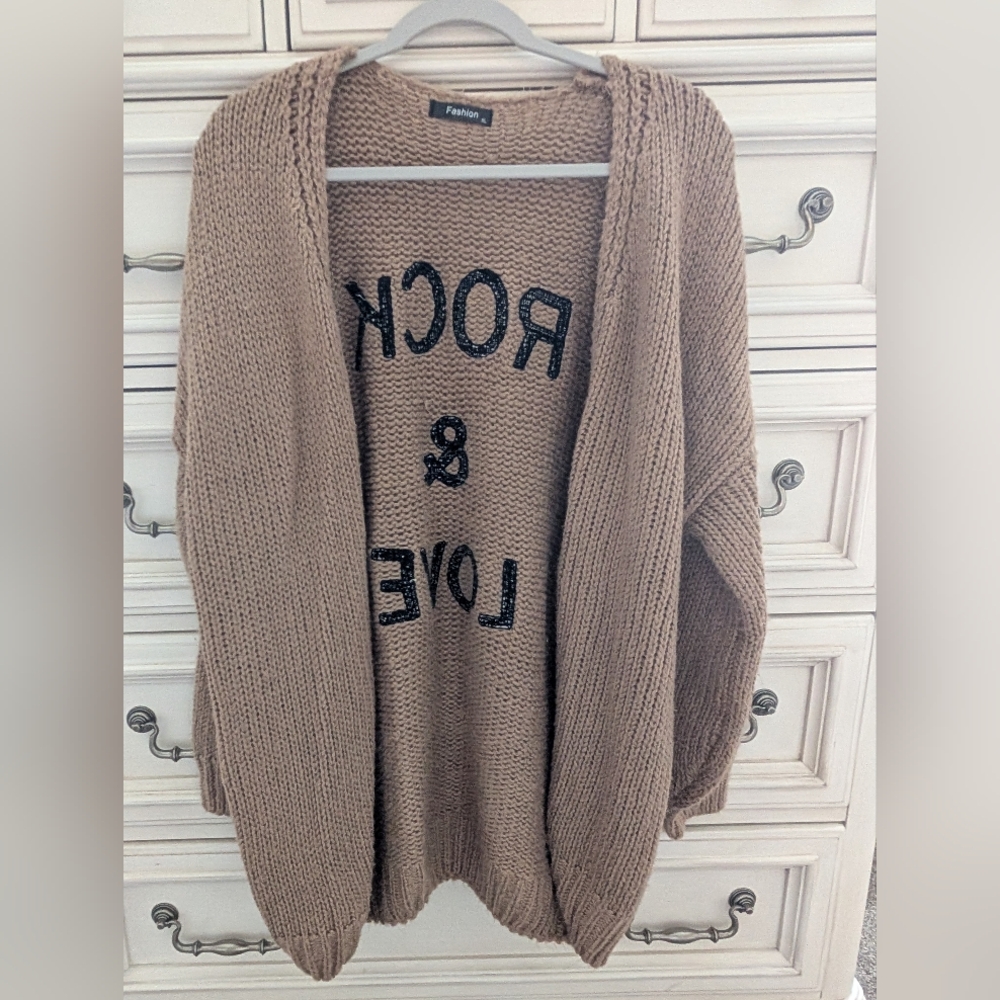 Tan Sweater with Black Text